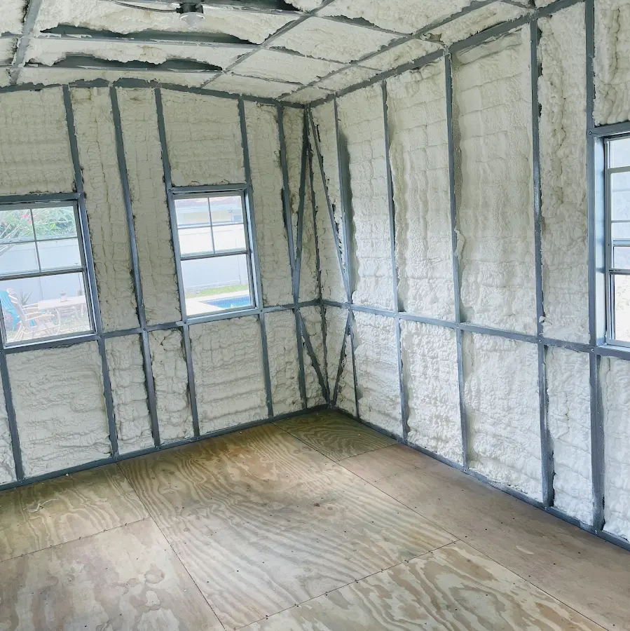 Closed-cell spray foam insulation applied to wall cavities in a residential project in Woodward